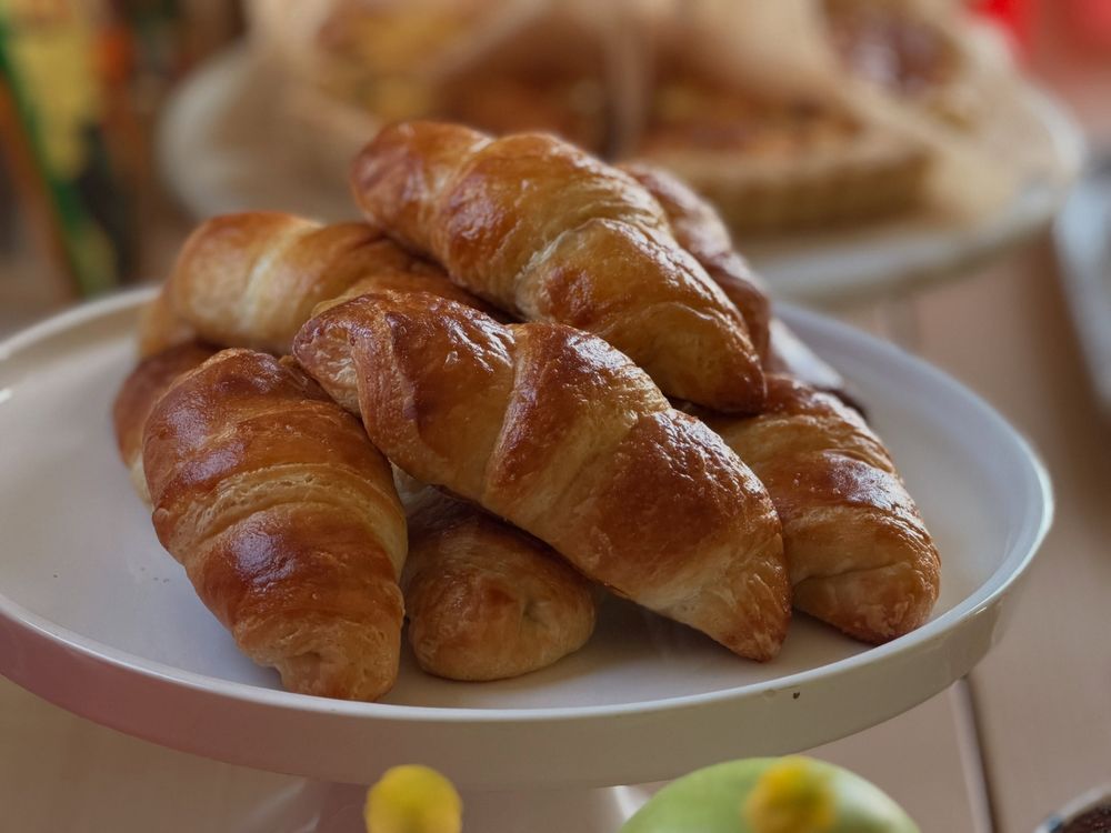 Butter croissants on a cake stand