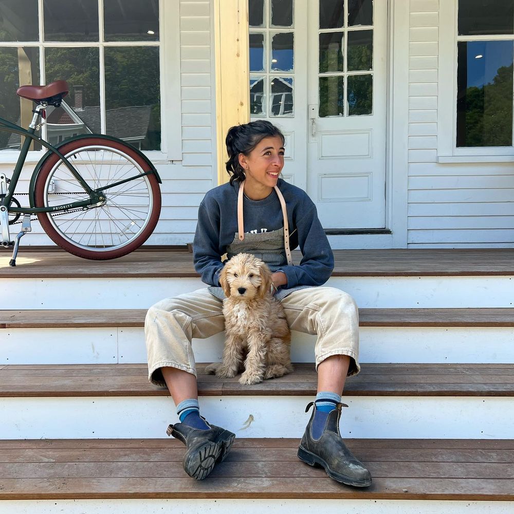 Sailor and the bakery pup on the porch steps